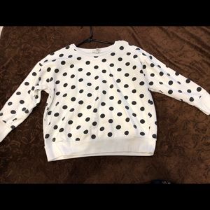 A long sleeve Polk a dot shirt.